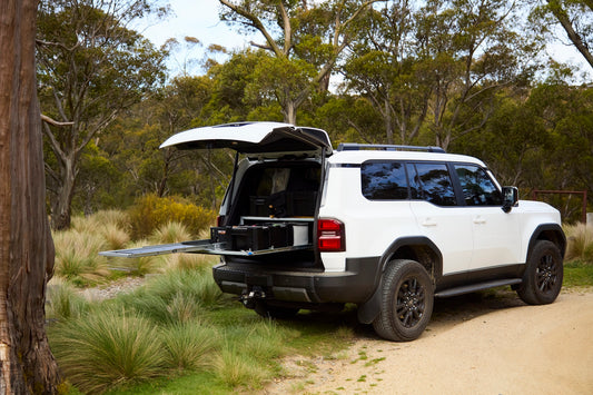 BootKamp Unit 1 + IGT Slide in open Prado 250 boot at a Snowy Mountains campsite