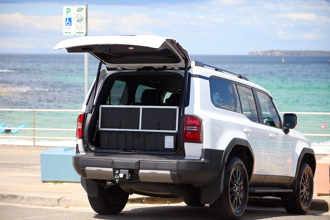 Unit 2 drawers extended over the third seat row in a 7-seat Prado 250